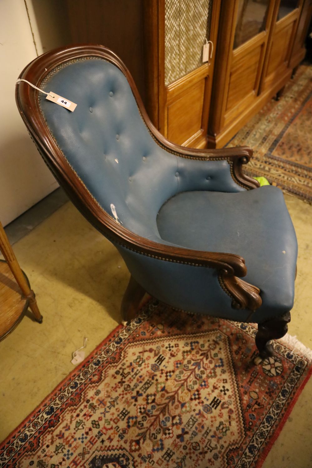 A Victorian mahogany spoonback armchair